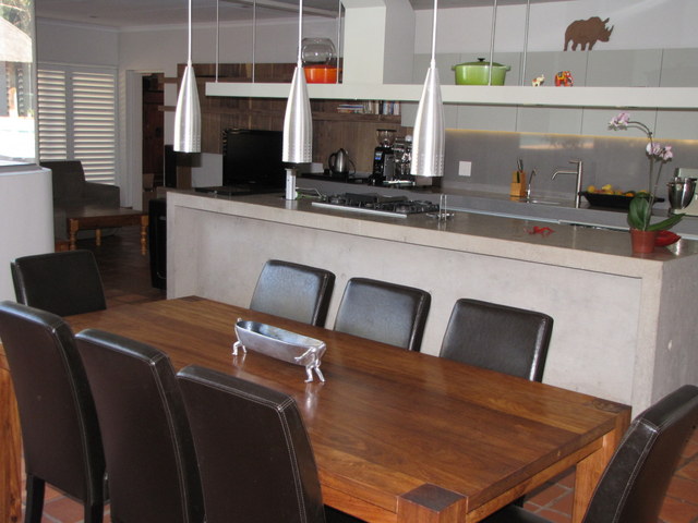 a stunning flow from dining room to kitchen